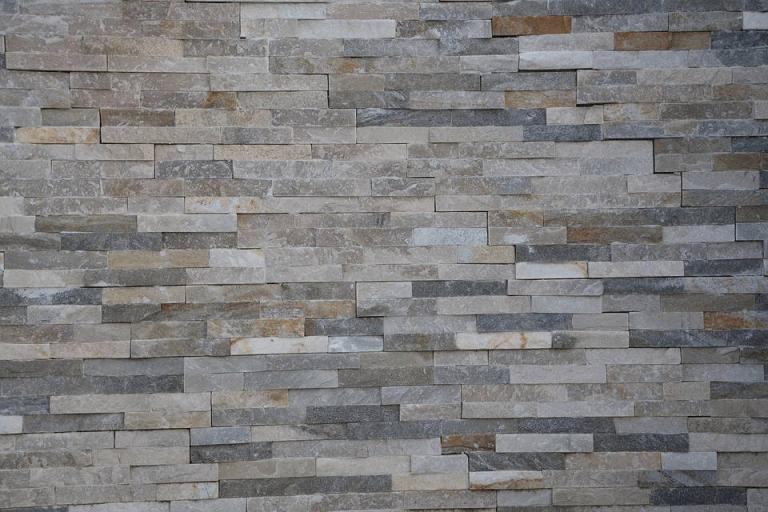 A wall with a stone veneer