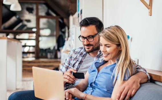 a couple sits on their couch