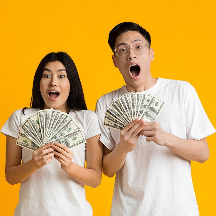 Asian couple with cash