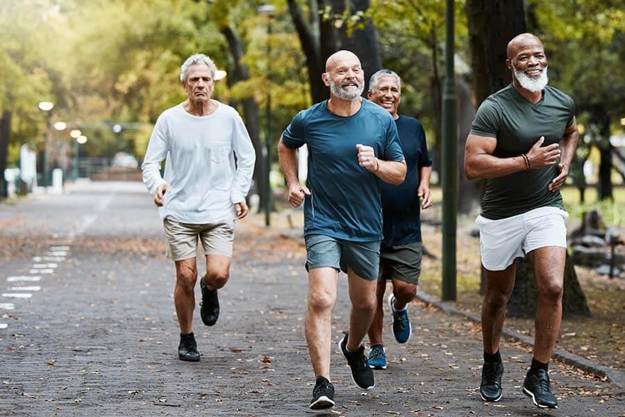 Older men running in a park