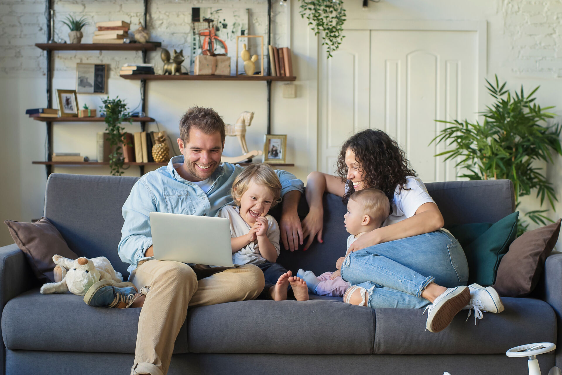 Young beautiful happy family relaxing at home