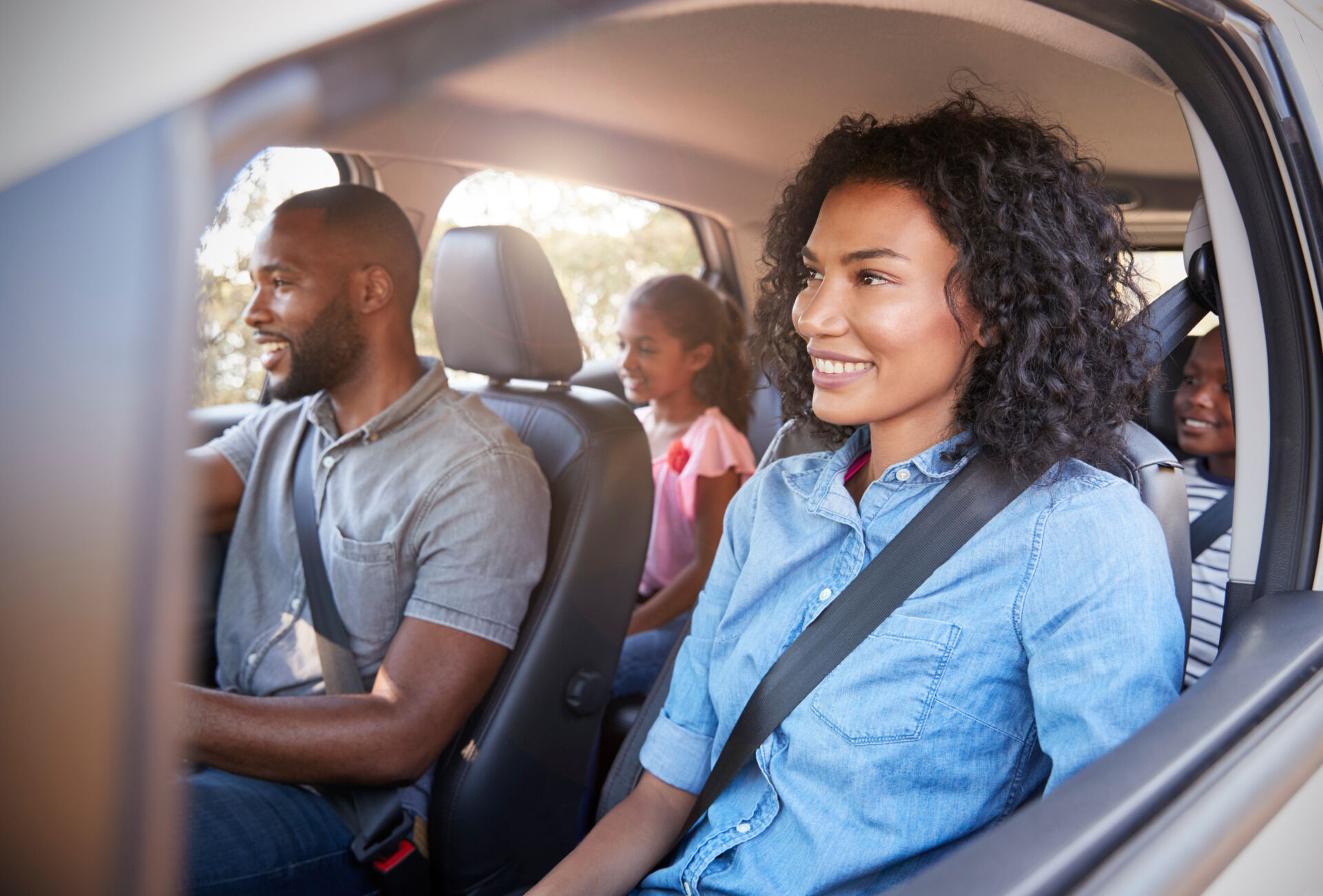 A family of four drives off happy after getting a credit union auto refinance.