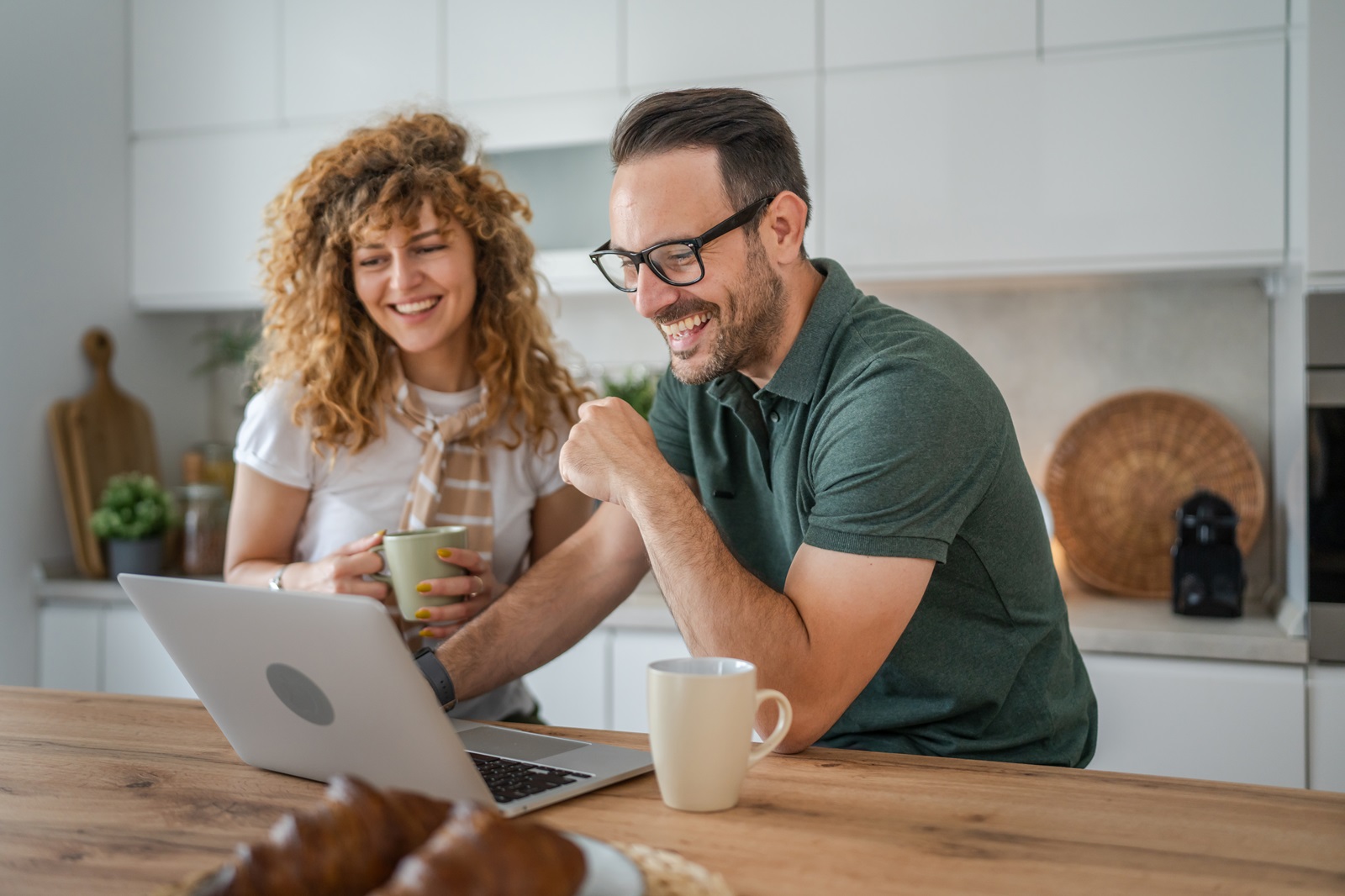 A couple researches home improvement projects online that they will fund using a personal consumer loan.